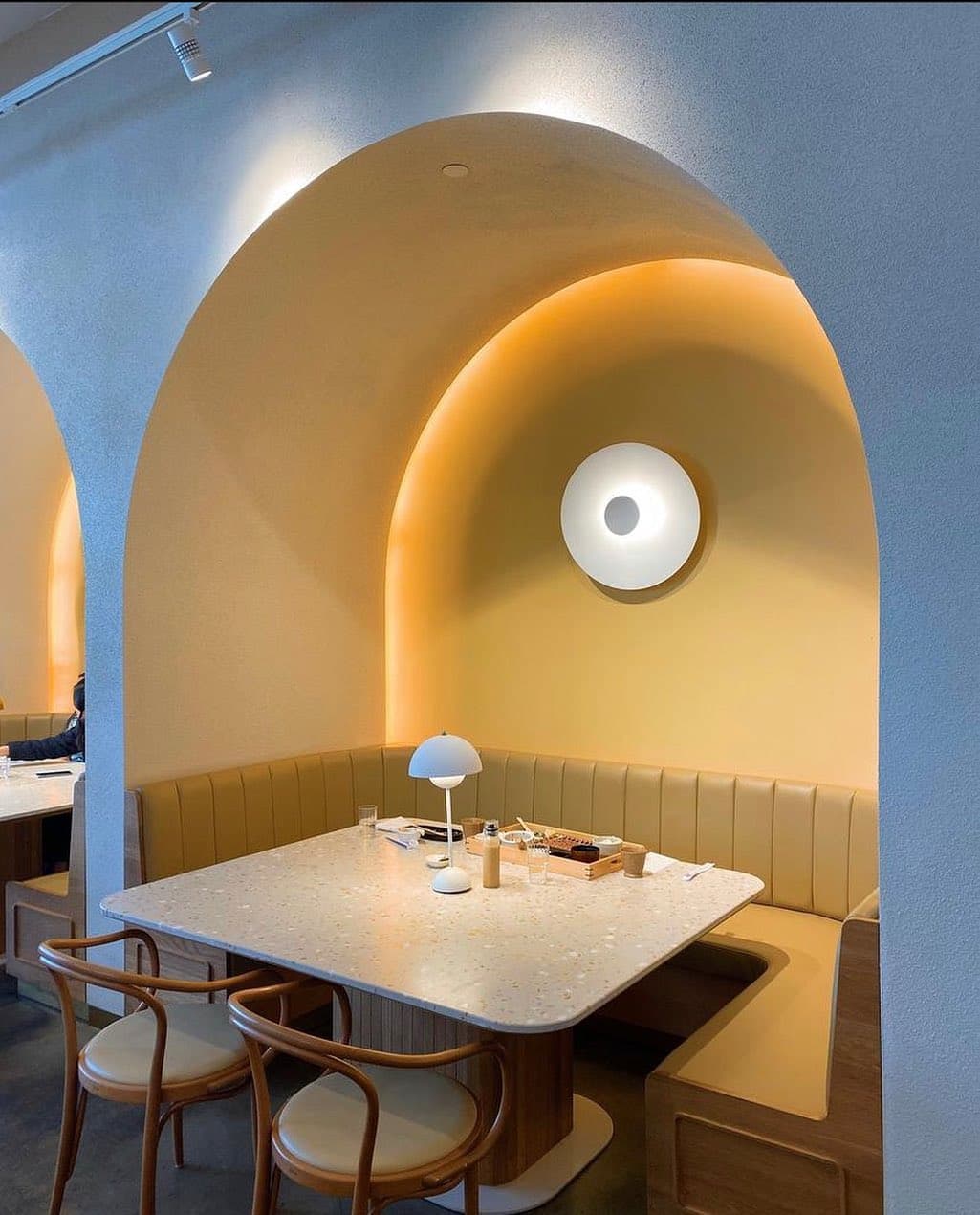 An arched booth in Saku's dining room